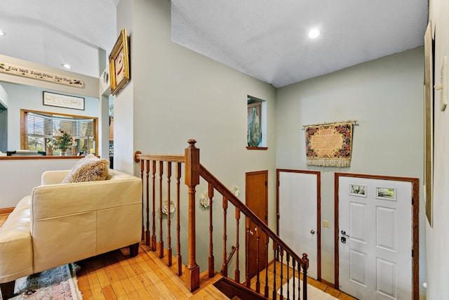 stairs featuring recessed lighting and wood-type flooring