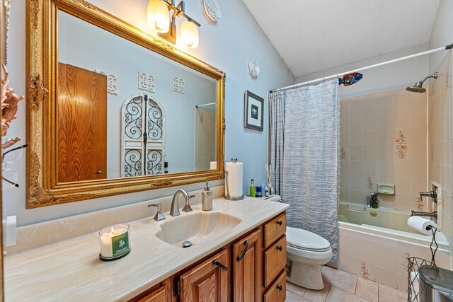 bathroom with tile patterned flooring, toilet, tiled shower / bath combo, and vanity