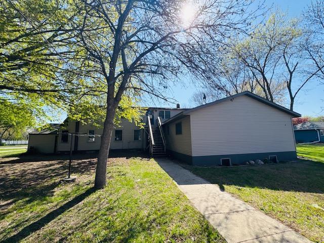 2526 Garnet Ave, Slayton, MN 56172 - view of property exterior featuring a lawn and stairs