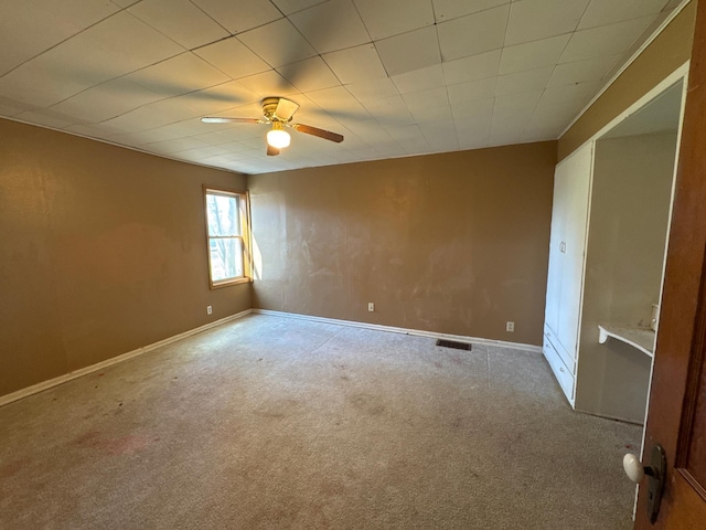 2526 Garnet Ave, Slayton, MN 56172 - unfurnished room featuring visible vents, baseboards, ceiling fan, and carpet floors