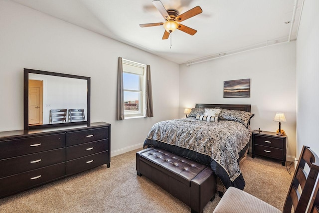 317 Main St W Unit 301, Ashland, WI 54806 - bedroom with light carpet, baseboards, and a ceiling fan