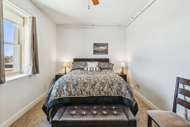 317 Main St W Unit 301, Ashland, WI 54806 - bedroom featuring carpet floors, baseboards, and ceiling fan
