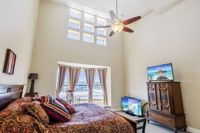 317 Main St W Unit 301, Ashland, WI 54806 - carpeted bedroom featuring a high ceiling, baseboards, and ceiling fan