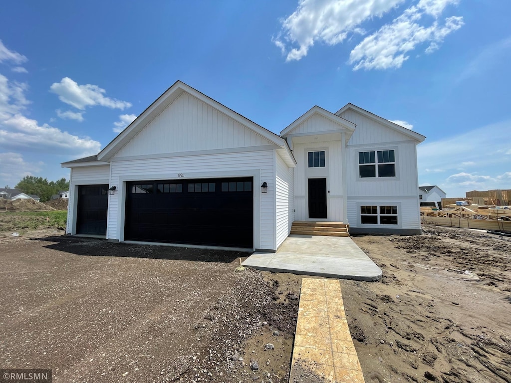 19911 English Ave N, Forest Lake, MN 55025 - view of front of house featuring an attached garage and driveway
