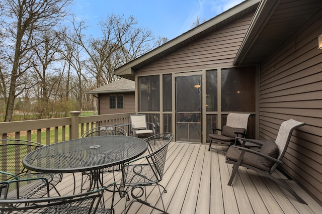 deck with outdoor dining area