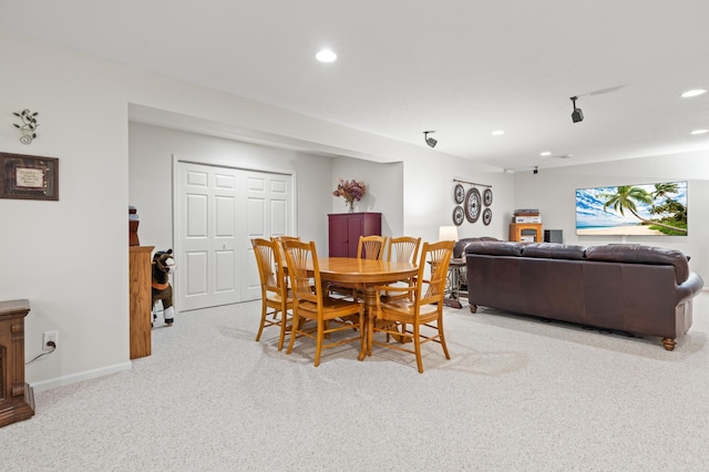 dining space with recessed lighting, carpet flooring, and baseboards