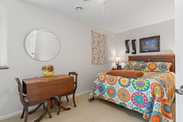 carpeted bedroom featuring baseboards