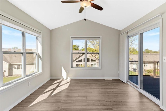 983 Aurora Cir, Red Wing, MN 55066 - empty room featuring healthy amount of natural light, a ceiling fan, lofted ceiling, and wood finished floors