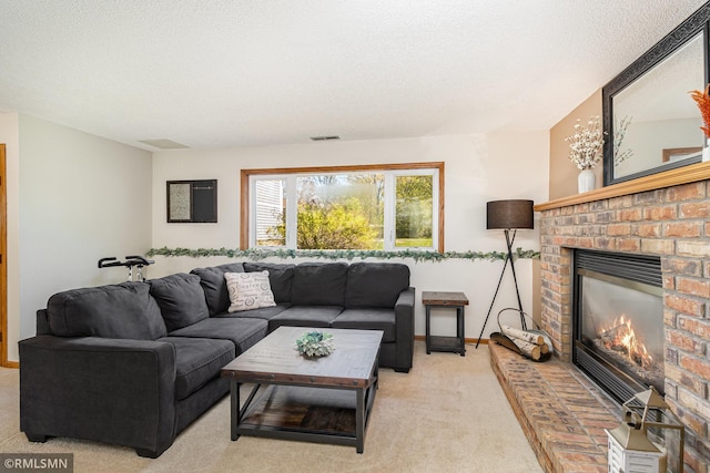 living area featuring a brick fireplace, light carpet, a textured ceiling, and baseboards