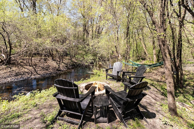 view of yard with an outdoor fire pit