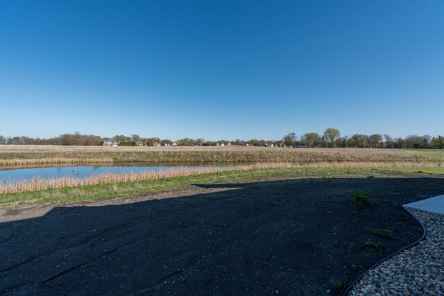 view of yard featuring a view of countryside and a water view