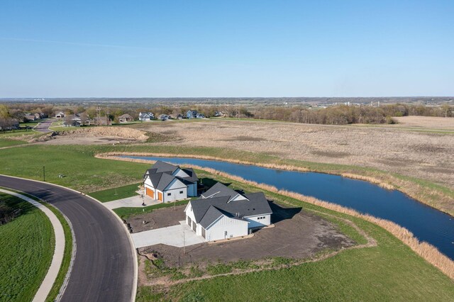 drone / aerial view featuring a rural view and a water view