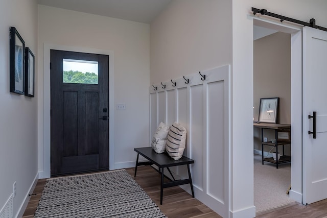 2132 Deerwood Dr, North Mankato, MN 56003 - mudroom with a barn door and wood finished floors