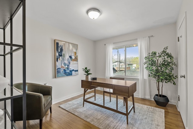 office with wood finished floors and baseboards