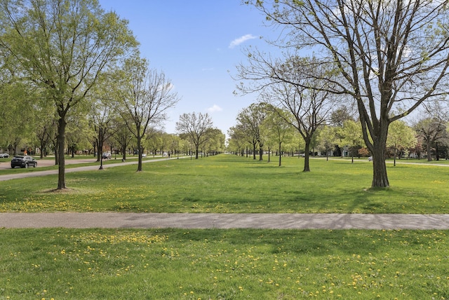 view of property's community with a yard