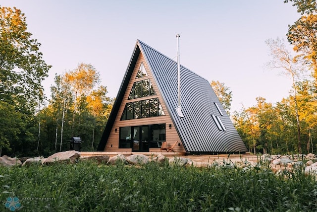21574 State 200, Rice Twp, MN 56621 - rear view of house with a standing seam roof and metal roof