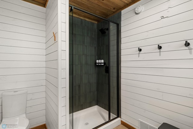 21574 State 200, Rice Twp, MN 56621 - bathroom featuring wooden ceiling, a stall shower, wood walls, and toilet