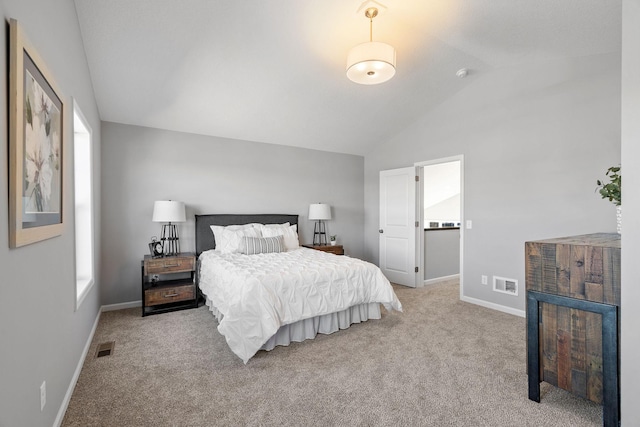 bedroom with lofted ceiling, carpet floors, baseboards, and visible vents