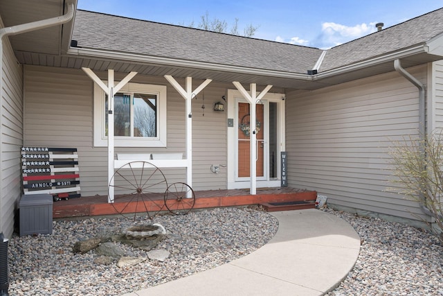 404 6th St NW, New Richland, MN 56072 - property entrance featuring roof with shingles and a porch