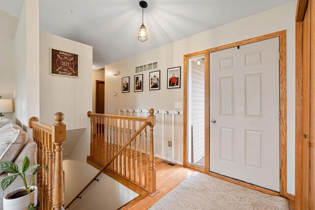 404 6th St NW, New Richland, MN 56072 - foyer entrance featuring light wood-type flooring