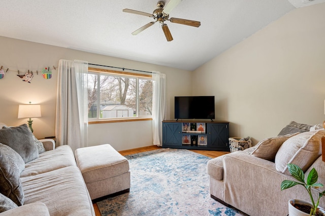 404 6th St NW, New Richland, MN 56072 - living room with lofted ceiling, a ceiling fan, and wood finished floors
