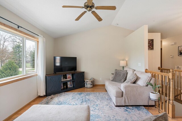 404 6th St NW, New Richland, MN 56072 - living area with ceiling fan, light wood-style floors, lofted ceiling, and baseboards
