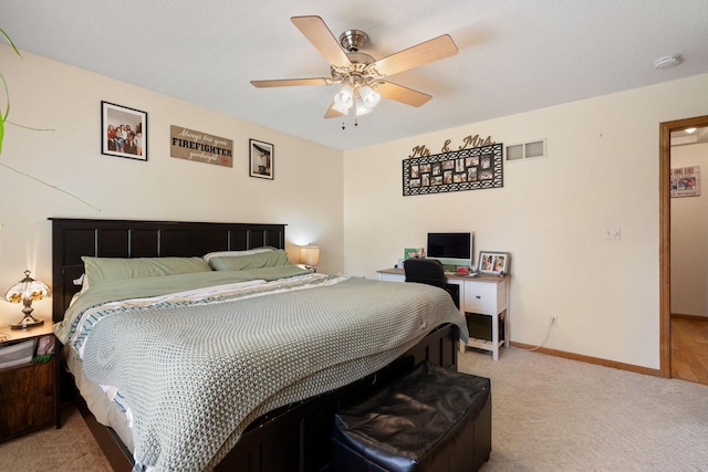 404 6th St NW, New Richland, MN 56072 - bedroom featuring light colored carpet, baseboards, and a ceiling fan