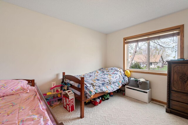 404 6th St NW, New Richland, MN 56072 - bedroom with carpet and baseboards