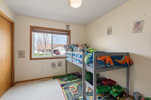 404 6th St NW, New Richland, MN 56072 - carpeted bedroom featuring baseboards