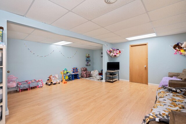 404 6th St NW, New Richland, MN 56072 - game room with a paneled ceiling and wood finished floors