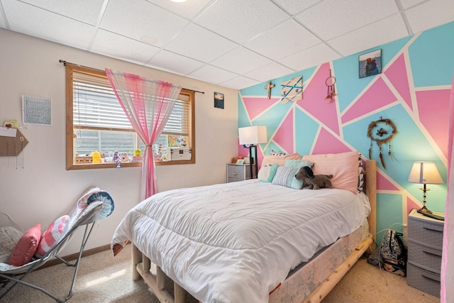 404 6th St NW, New Richland, MN 56072 - bedroom with carpet, a paneled ceiling, and baseboards