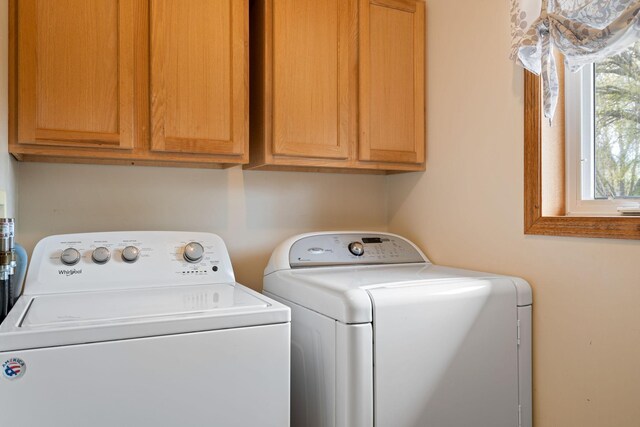 404 6th St NW, New Richland, MN 56072 - washroom featuring independent washer and dryer and cabinet space