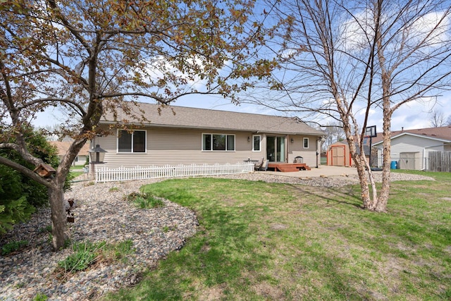 404 6th St NW, New Richland, MN 56072 - back of house with a shed and an outbuilding
