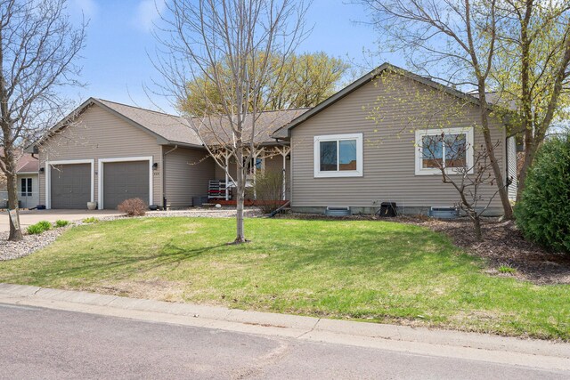 404 6th St NW, New Richland, MN 56072 - ranch-style home with an attached garage, a front yard, and concrete driveway