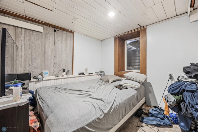 bedroom with wood walls, recessed lighting, and wooden ceiling