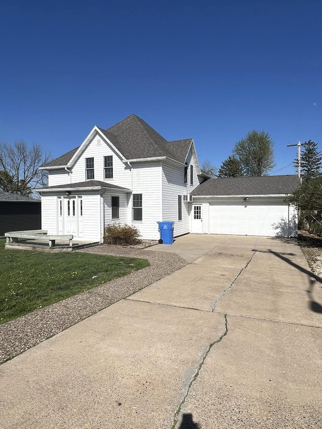 21 1st St SE, Altura, MN 55910 - view of home's exterior with concrete driveway, a yard, a shingled roof, and an attached garage