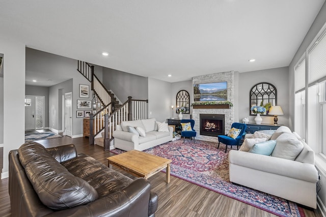 825 Spancil Hill Vw, Woodbury, MN 55129 - living area with wood finished floors, baseboards, stairs, recessed lighting, and a stone fireplace