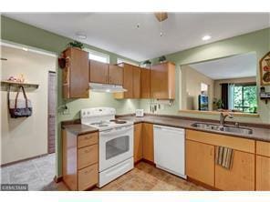 20 Windsor Ln Unit 303A, New Brighton, MN 55112 - kitchen featuring white appliances, a sink, exhaust hood, recessed lighting, and dark countertops