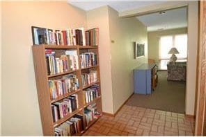 20 Windsor Ln Unit 303A, New Brighton, MN 55112 - hall with brick patterned floors and baseboards