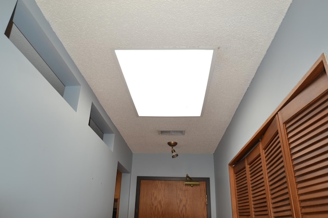 20 Windsor Ln Unit 303A, New Brighton, MN 55112 - hallway featuring a textured ceiling