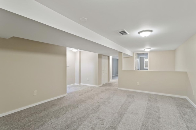 basement with carpet flooring and baseboards