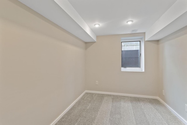 basement with baseboards and carpet floors