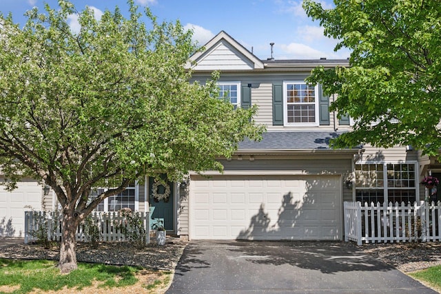 13700 54th Ave N Unit 405, Plymouth, MN 55446 - view of front facade featuring asphalt driveway and a garage