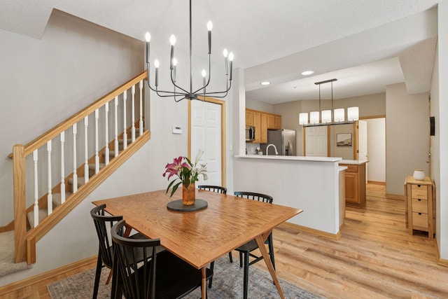 13700 54th Ave N Unit 405, Plymouth, MN 55446 - dining space featuring a chandelier, light wood-style flooring, stairs, recessed lighting, and baseboards