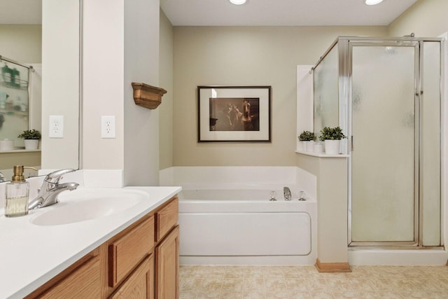 13700 54th Ave N Unit 405, Plymouth, MN 55446 - bathroom featuring a shower stall, vanity, a garden tub, and recessed lighting