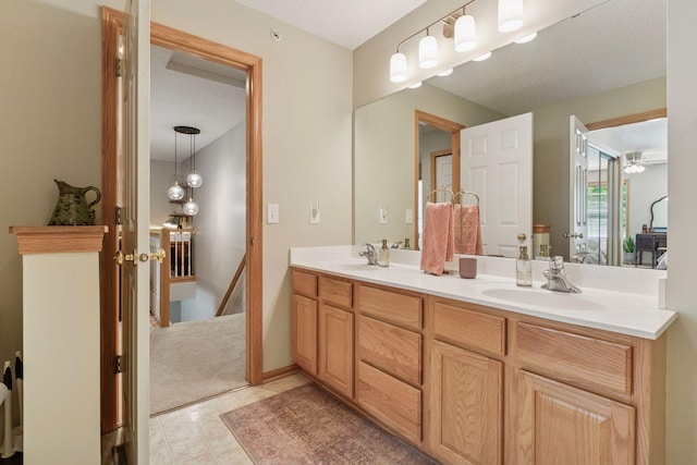 13700 54th Ave N Unit 405, Plymouth, MN 55446 - bathroom with double vanity and a ceiling fan