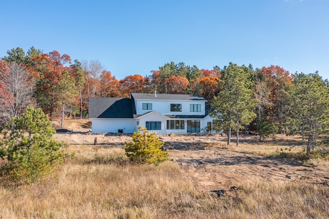 view of front of property featuring roof with shingles