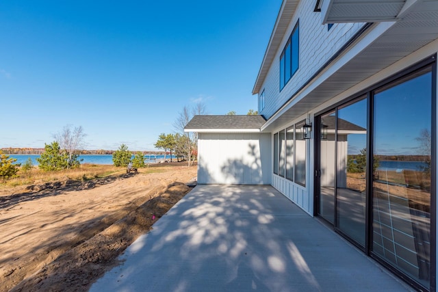 view of patio featuring a water view