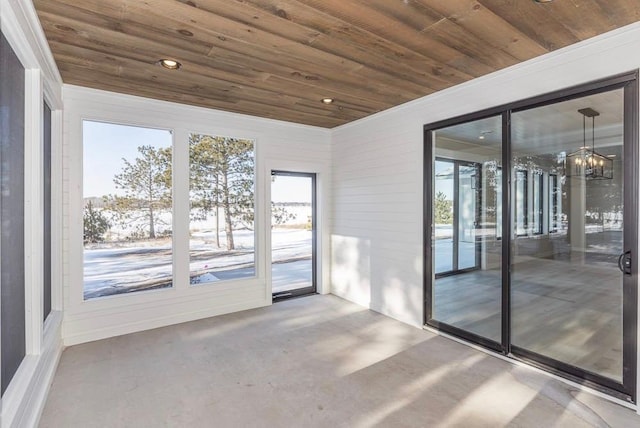 unfurnished sunroom with a chandelier