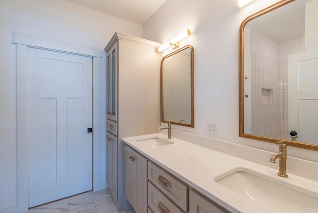 bathroom with marble look tiles and double vanity